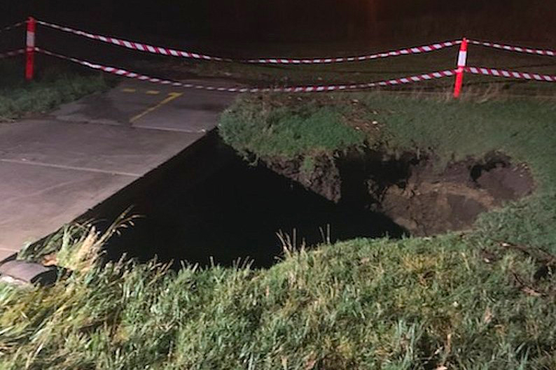 Article image for Storm damage: Wild weather causes flash flooding, opens up huge sinkhole