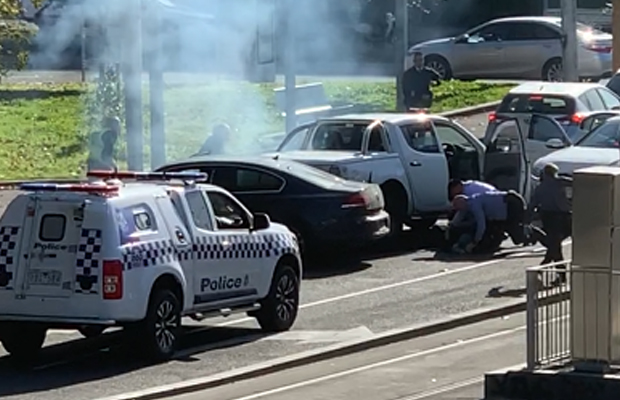 Article image for Two men arrested in dramatic fashion as police swarm on major intersection