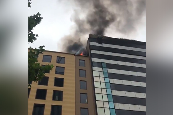 Article image for Rooftop blaze at Queen Street building reignites overnight