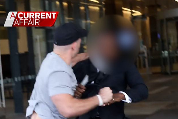 Article image for ‘A very violent attack’: Neo-Nazi filmed punching Channel Nine security guard in the head