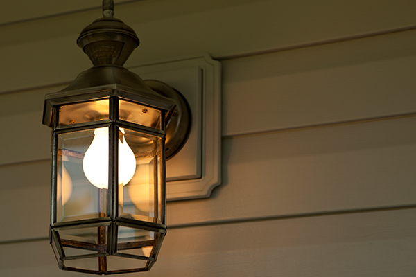 Light globe in lantern on front porch