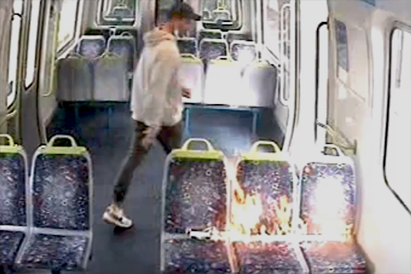 Article image for Police search for man who lit train fire in brazen daylight arson attack