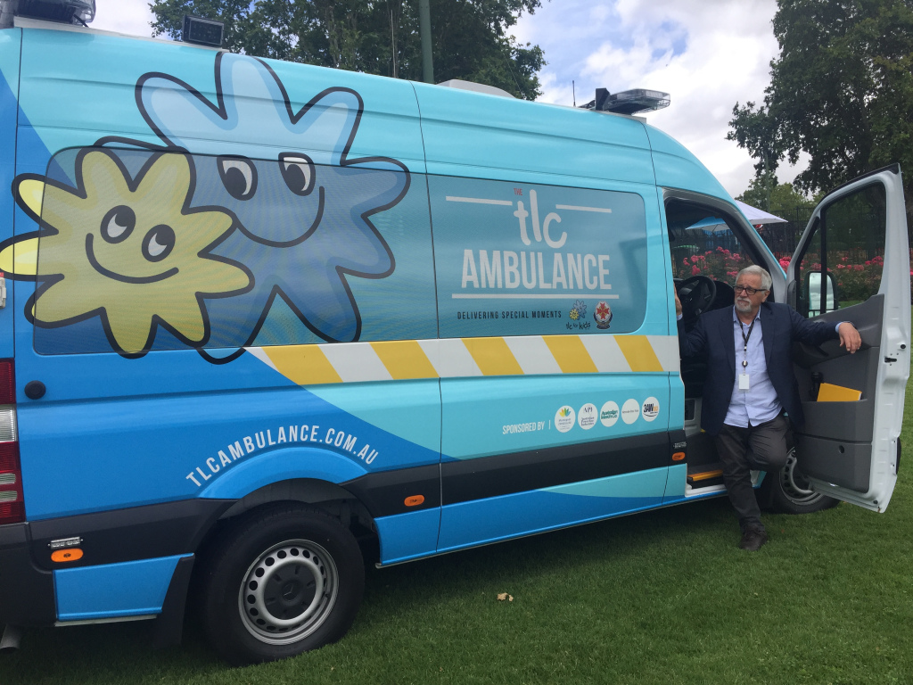 TLC Ambulance for Kids with Neil Mitchell standing in doorway
