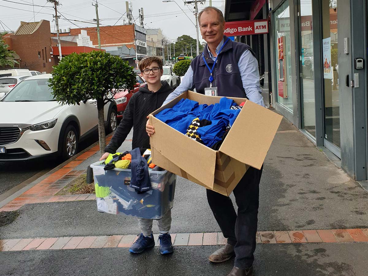 Socks4Support founder Benji and MP David Southwick holding boxes of donated socks