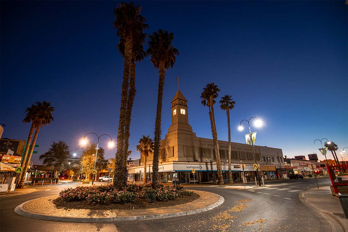 Street in Mildura with a roundabout and palm tree