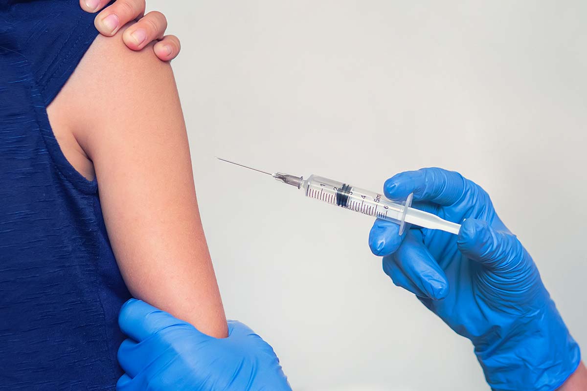 Child receiving covid-19 vaccine