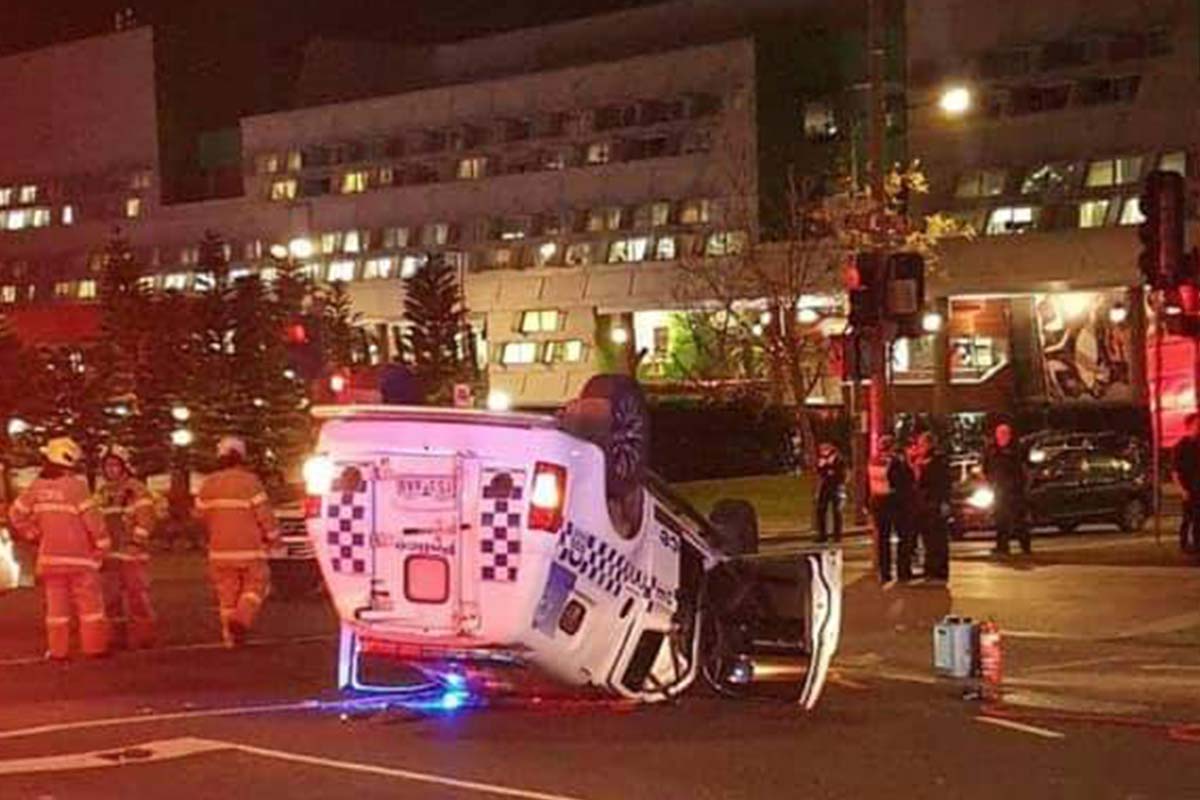 Article image for Police spend the night in hospital after car flips in dramatic Dandenong crash