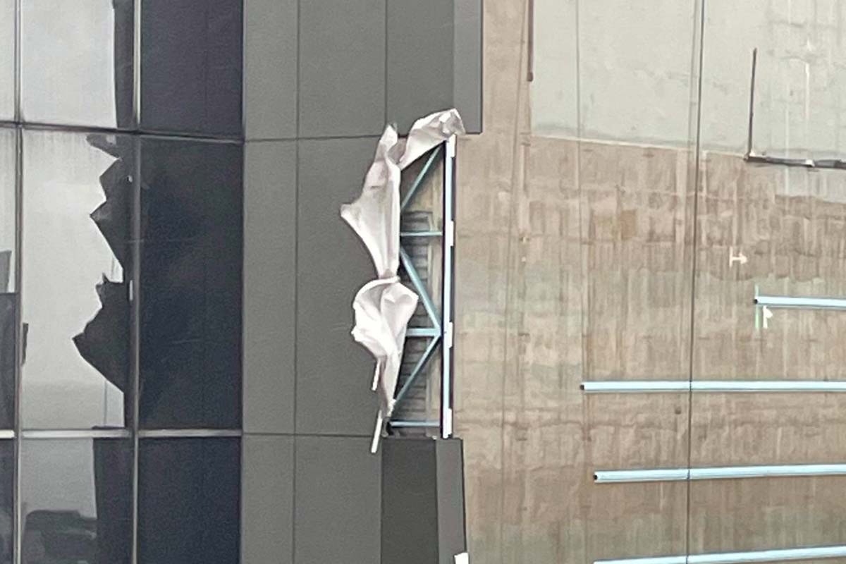 Article image for Wild winds strip panels from high rise building in CBD