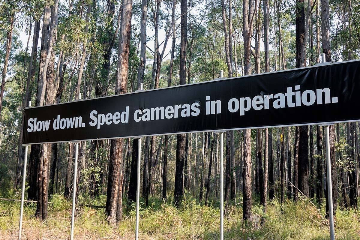 Speed camera sign on roadside