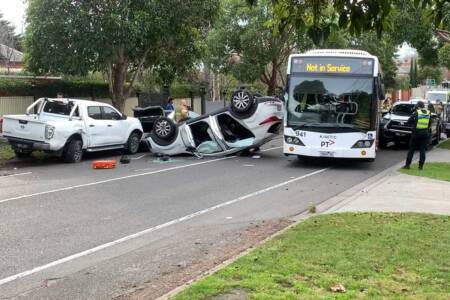 Car flips in confronting Camberwell crash