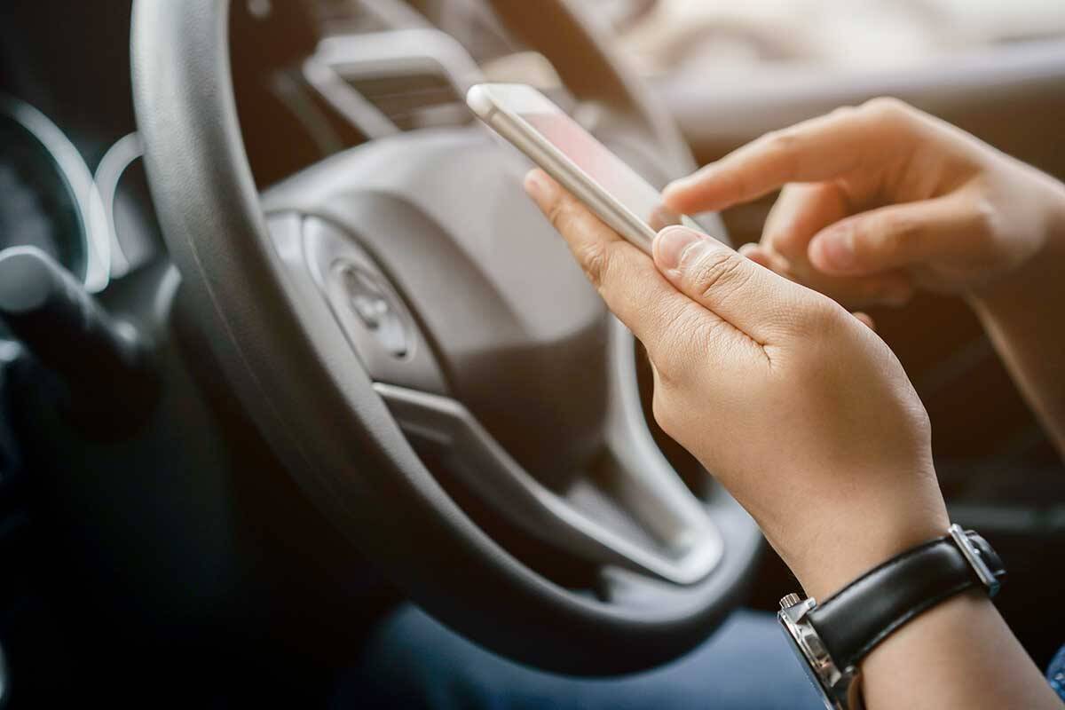 Article image for Man has phone use fine overturned on legal technicality