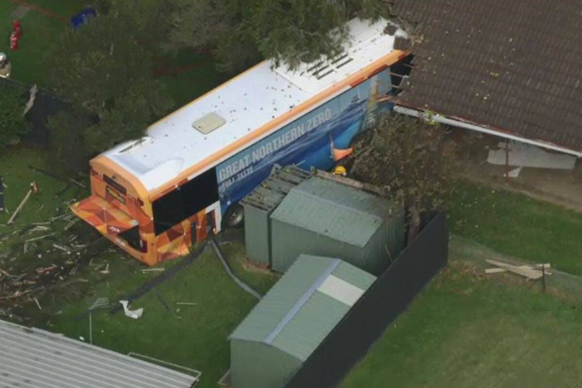 Article image for Bus crashes through two houses in Safety Beach