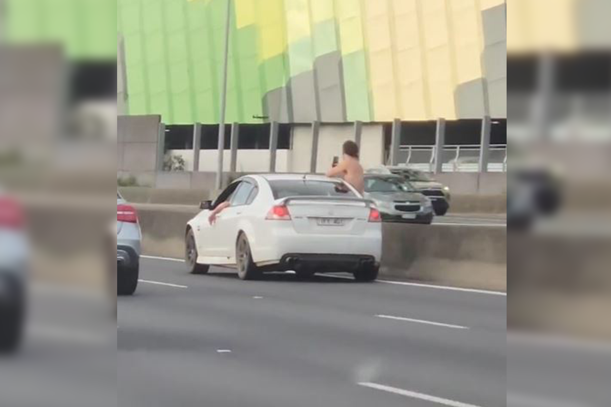 Article image for Man filmed hanging out of car in ‘scary’ Tullamarine Freeway incident