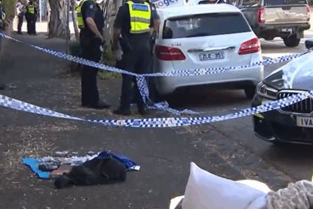 Man charged following bomb threats outside two Melbourne schools