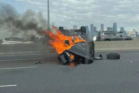 Traffic chaos as car flips and catches fire on CityLink